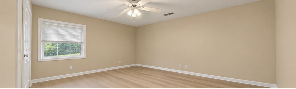 5 Richardson bedroom with beige walls and light wood LVP flooring